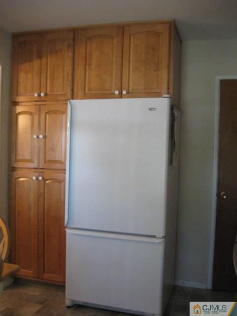 10 Glen Gary Road Middlesex, NJ 08846 - Photo 9 of 24 a white refrigerator freezer sitting in a kitchen