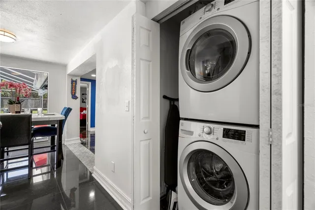 a view of a hallway with washer and dryer