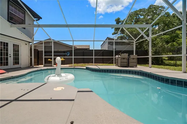 a view of a swimming pool with a patio
