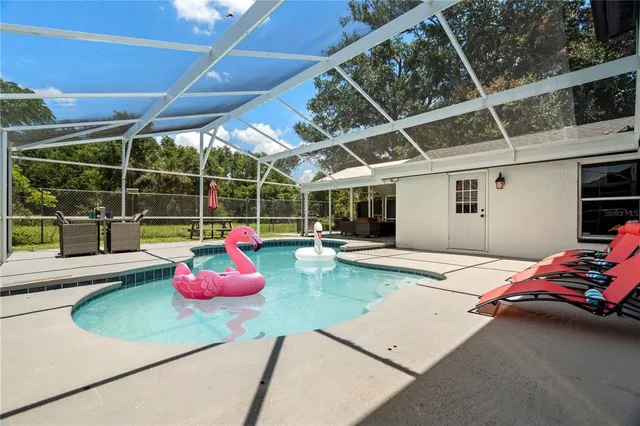 a bedroom with furniture and a tub