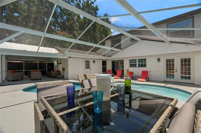 a view of a chairs and table in a patio
