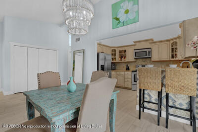 538 Riverside Drive Palm Beach Gardens, FL 33410 - Photo 13 of 52 a view of a dining room with furniture