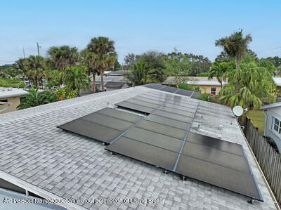 538 Riverside Drive Palm Beach Gardens, FL 33410 - Photo 31 of 52 a view of a backyard with sitting area