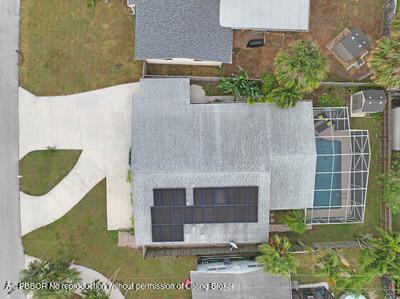538 Riverside Drive Palm Beach Gardens, FL 33410 - Photo 32 of 52 an aerial view of a house with a yard