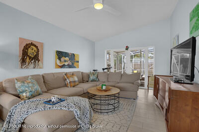 538 Riverside Drive Palm Beach Gardens, FL 33410 - Photo 4 of 52 a living room with furniture a couch and a flat screen tv