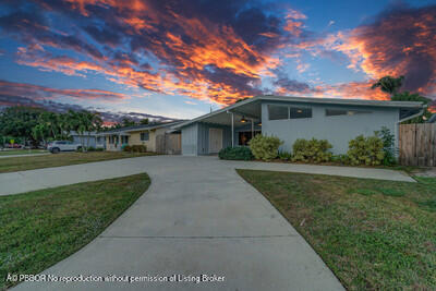 538 Riverside Drive Palm Beach Gardens, FL 33410 - Photo 41 of 52 a view of a porch with a yard