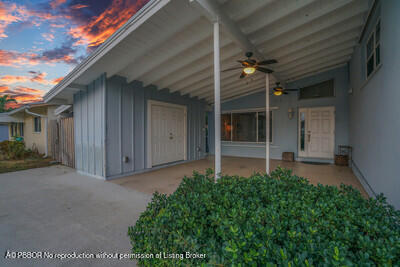 538 Riverside Drive Palm Beach Gardens, FL 33410 - Photo 43 of 52 front view of a house with a small yard