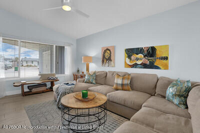 538 Riverside Drive Palm Beach Gardens, FL 33410 - Photo 5 of 52 a living room with furniture and a large window