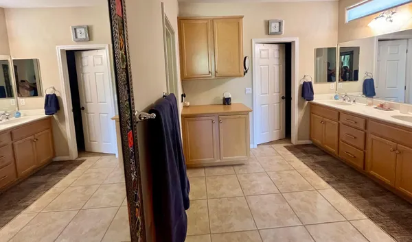 a kitchen with a refrigerator and a sink