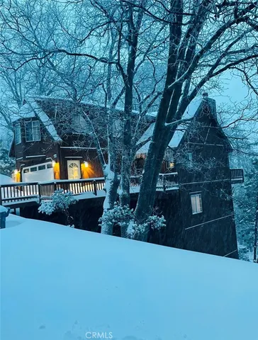 a view of a swimming pool with a bench and trees