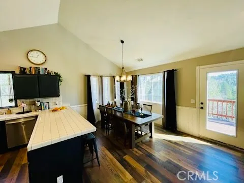 a large kitchen with kitchen island a sink stove and refrigerator