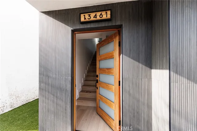 a view of a door and wooden floor