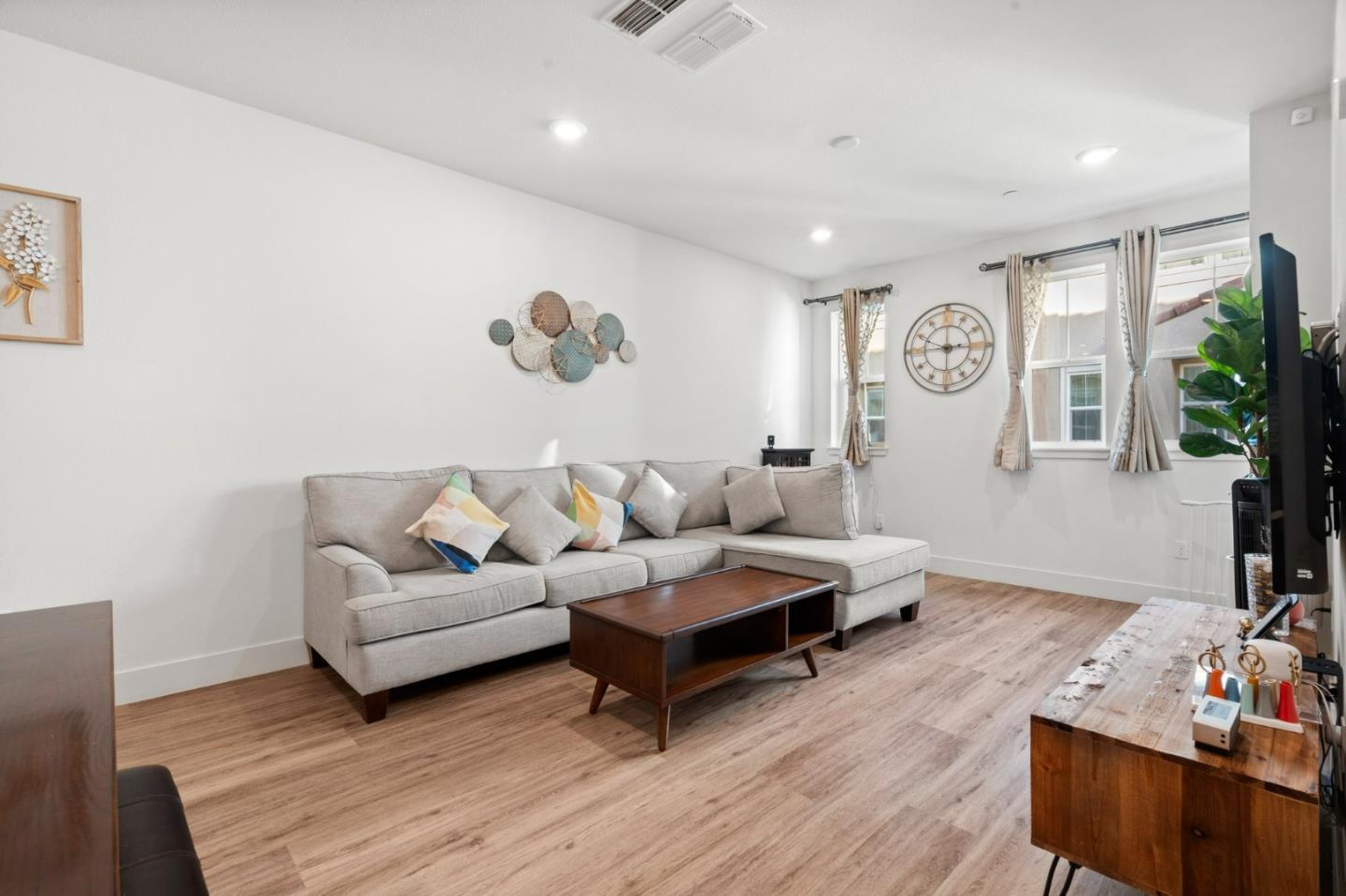 718 Amalfi Loop Milpitas, CA 95035 - Photo 12 of 37 a living room with furniture and wooden floor