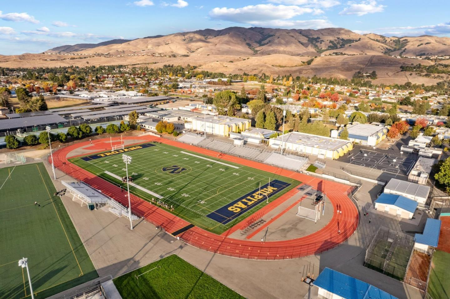 718 Amalfi Loop Milpitas, CA 95035 - Photo 32 of 37 an aerial view of a tennis ground and a city view