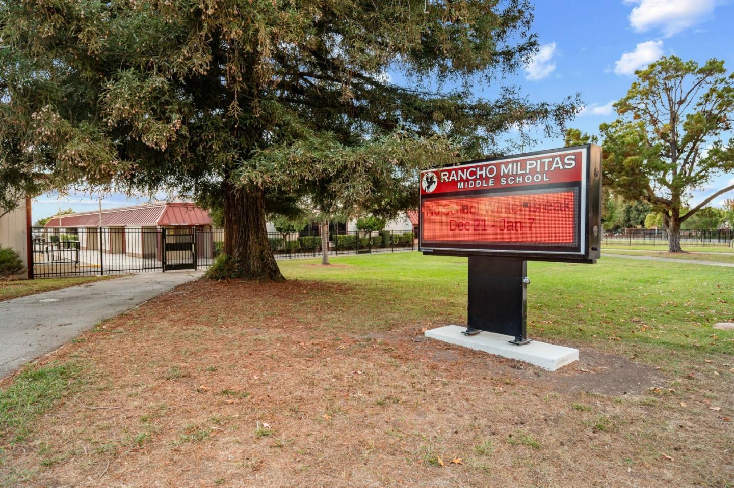 718 Amalfi Loop Milpitas, CA 95035 - Photo 34 of 37 a sign board with parking space in back