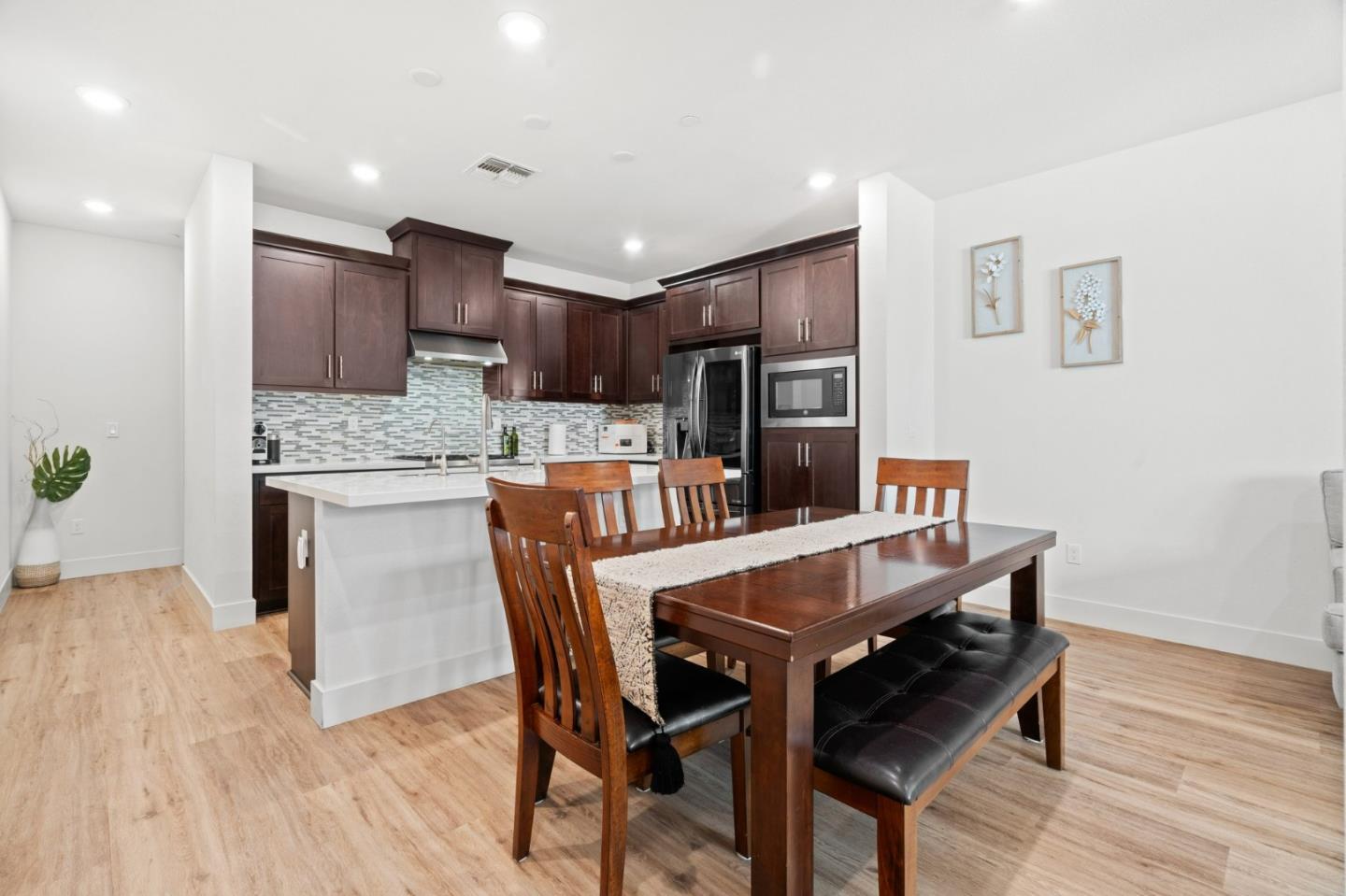 718 Amalfi Loop Milpitas, CA 95035 - Photo 4 of 37 a dining room with furniture and wooden floor