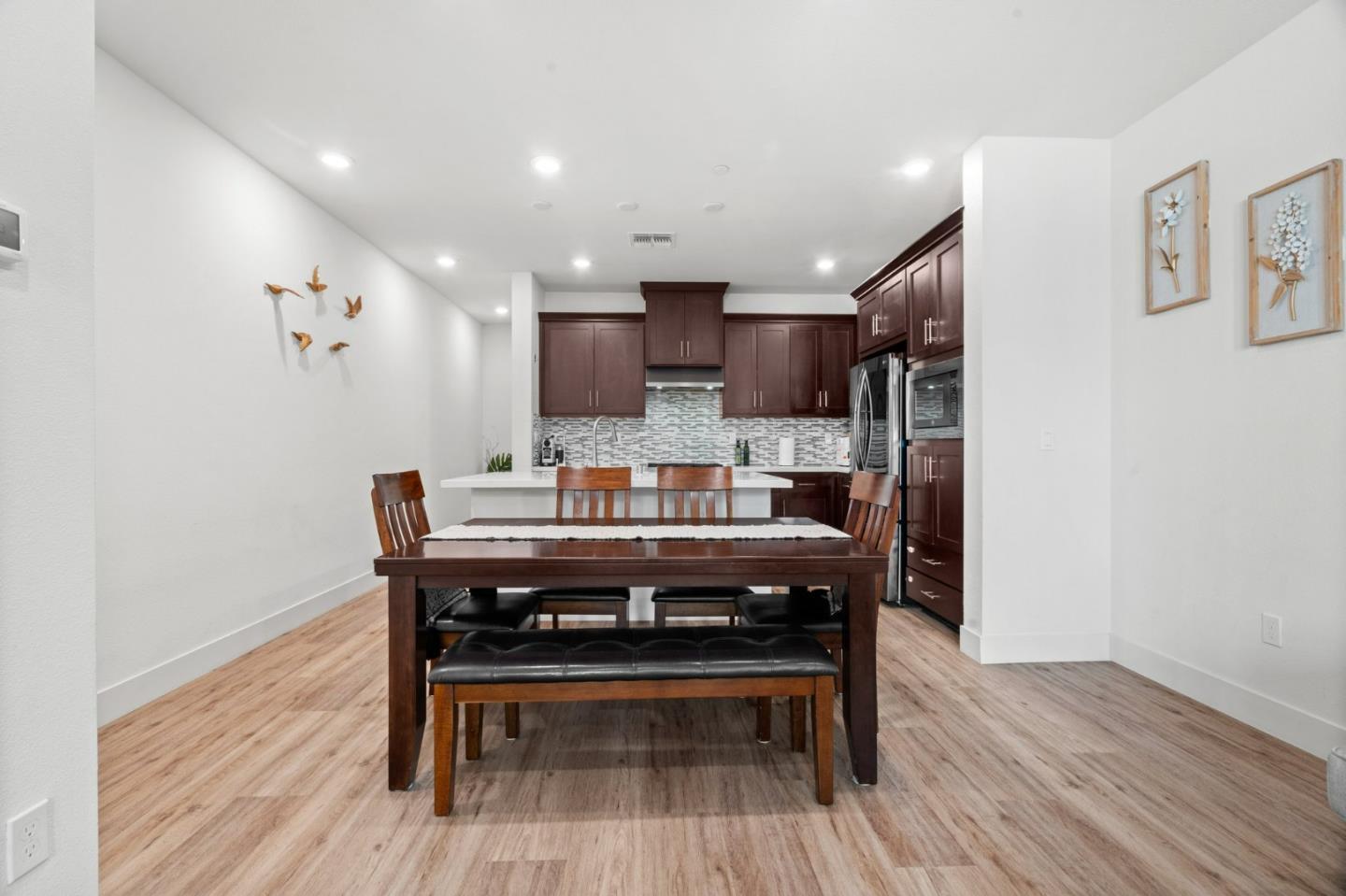 718 Amalfi Loop Milpitas, CA 95035 - Photo 5 of 37 a view of a kitchen with a table and chairs