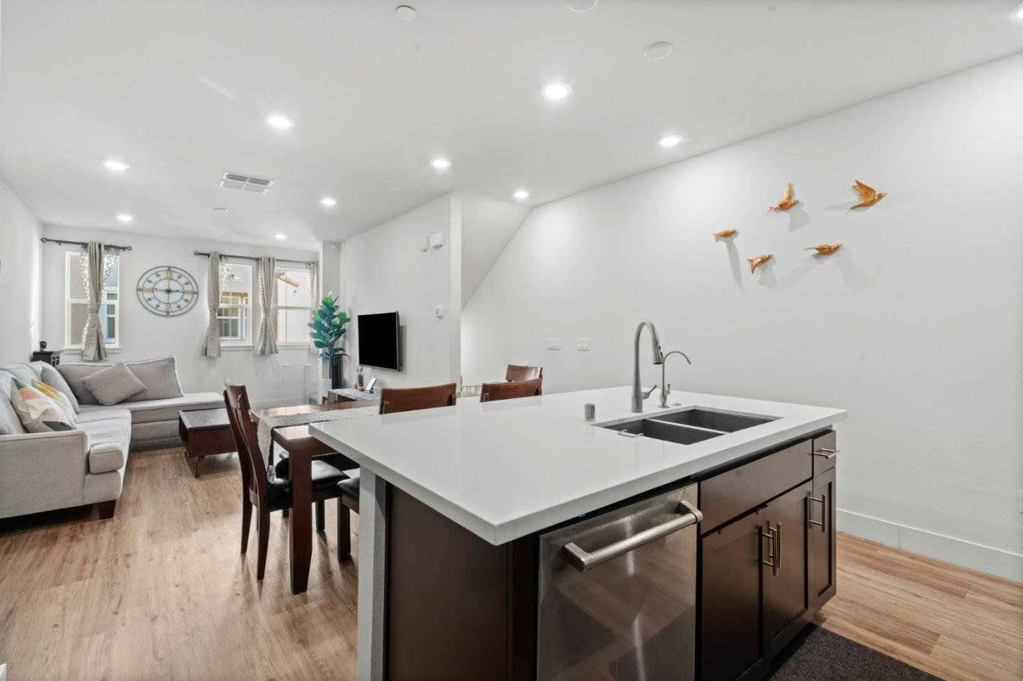 718 Amalfi Loop Milpitas, CA 95035 - Photo 9 of 37 a view of a kitchen area with furniture and wooden floor