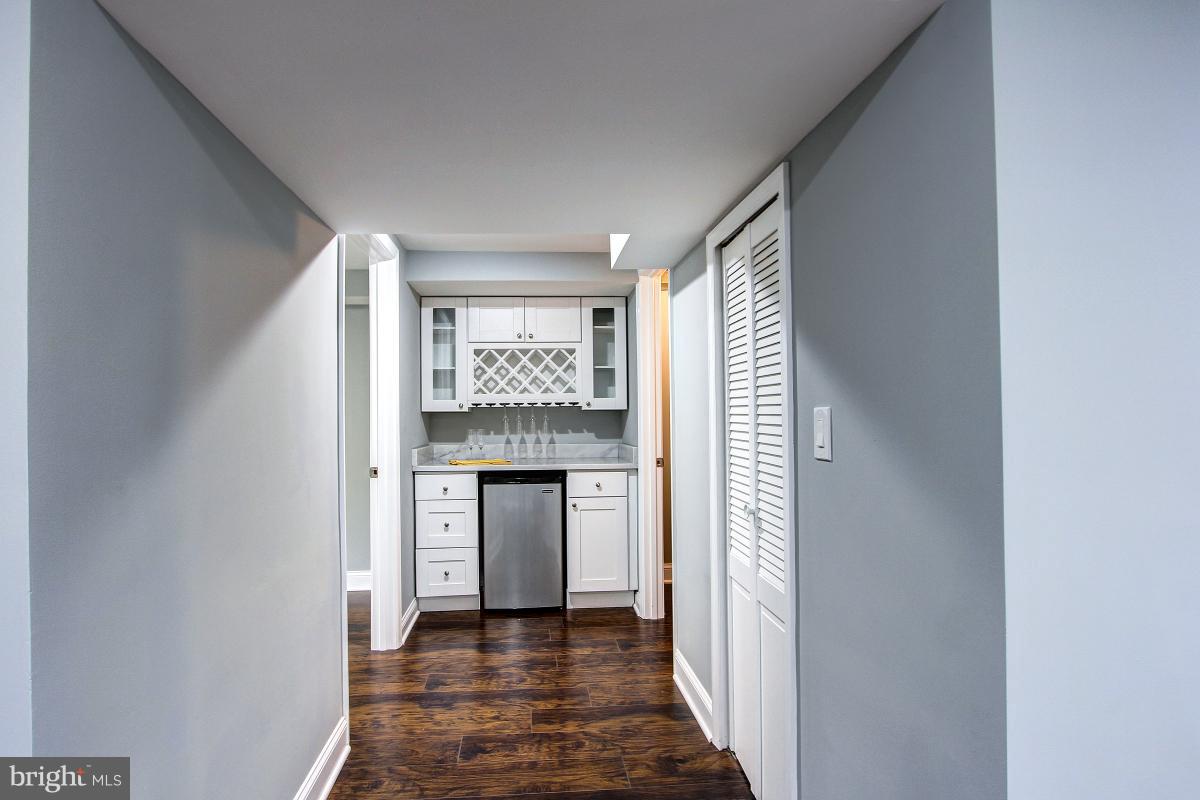 8317 Piney Branch Road Silver Spring, MD 20910 - Photo 23 of 30 BAR WITH FRIDGE AND LOTS OF STORAGE