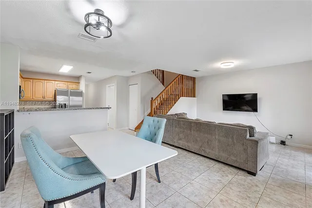 a spacious bedroom with a bed couch and a window