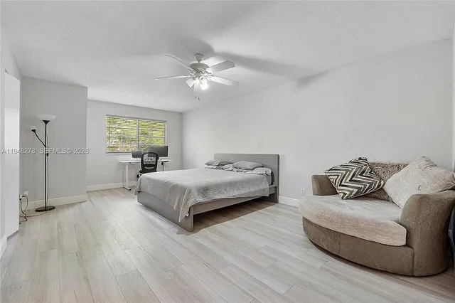 a bedroom with a bed and a table