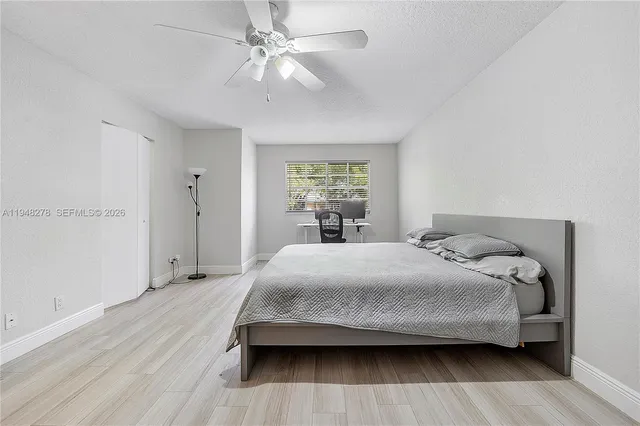 a bathroom with a sink toilet and a mirror