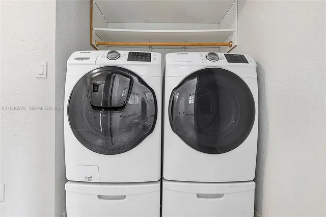 a view of a livingroom with furniture and windows