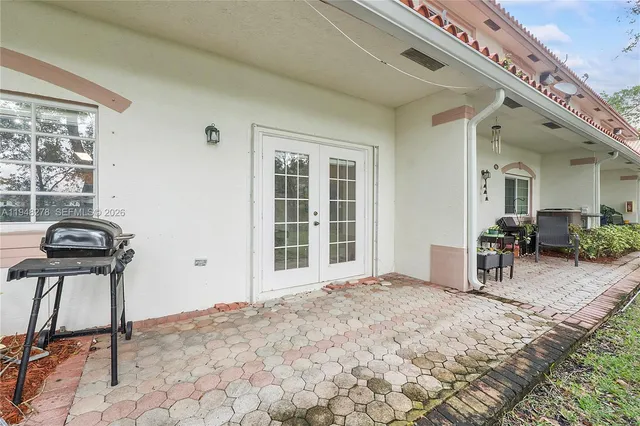 a view of a house with a yard and plants