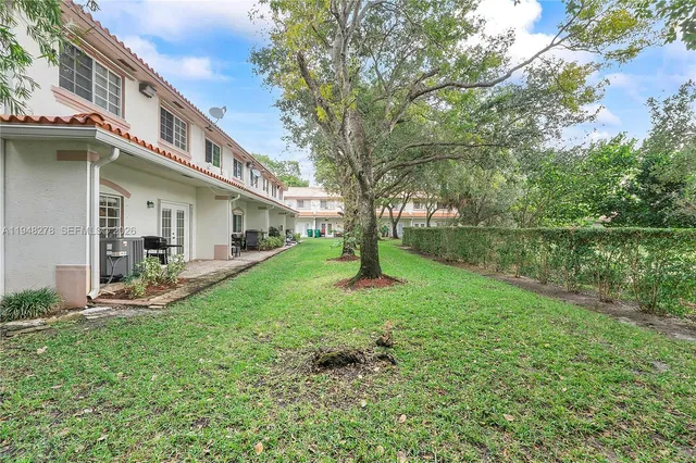 a view of a house with a yard porch and sitting area