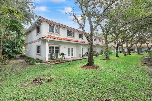 a view of a park with large trees