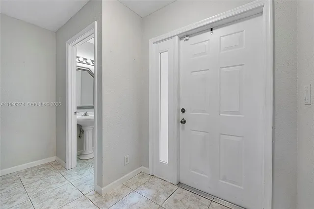 a living room with couches and a flat screen tv