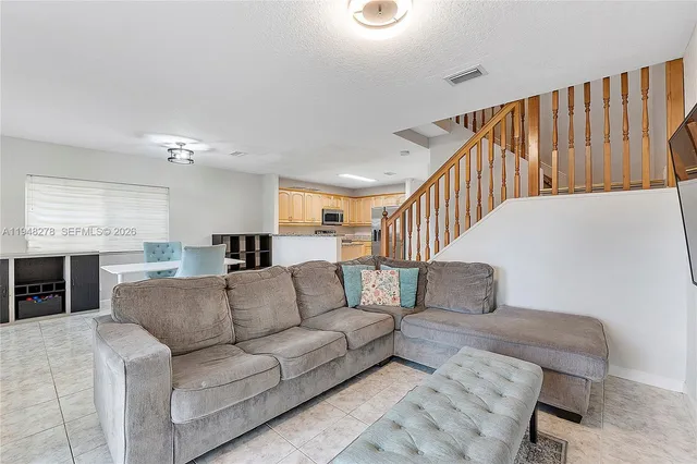 a kitchen with a stove a sink and a microwave