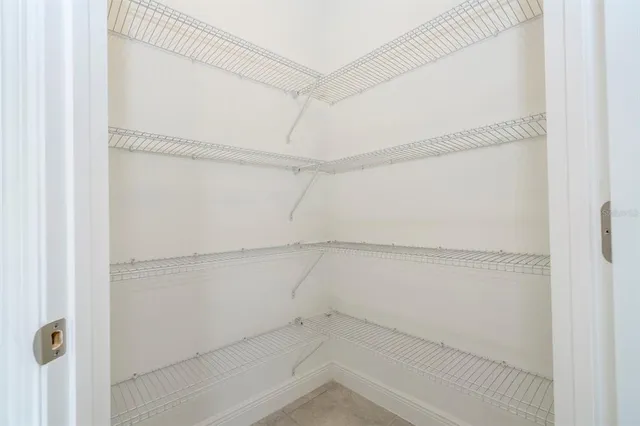 an empty room with a empty space and windows