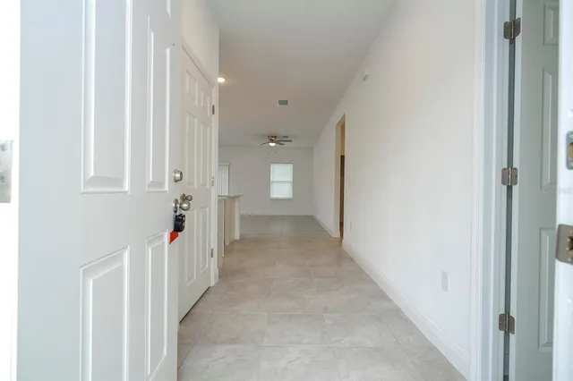 a view of a hallway with a white walls