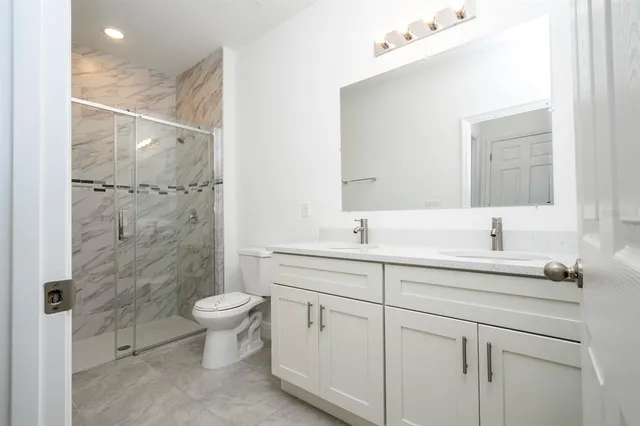 a bathroom with a sink and mirror