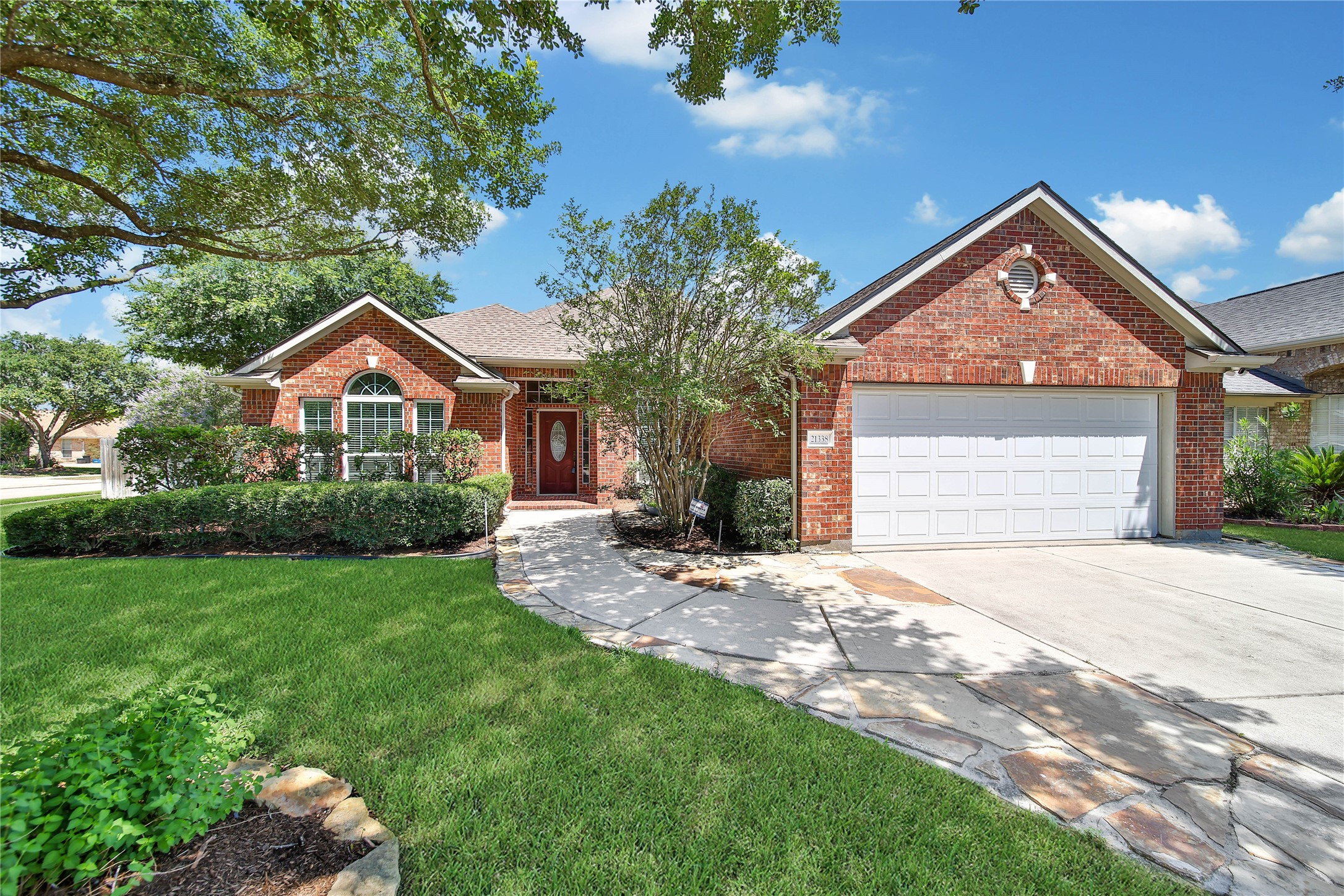 21338 Timber Pines Drive Spring, TX 77388 - Photo 1 of 29 a front view of a house with a yard and garage
