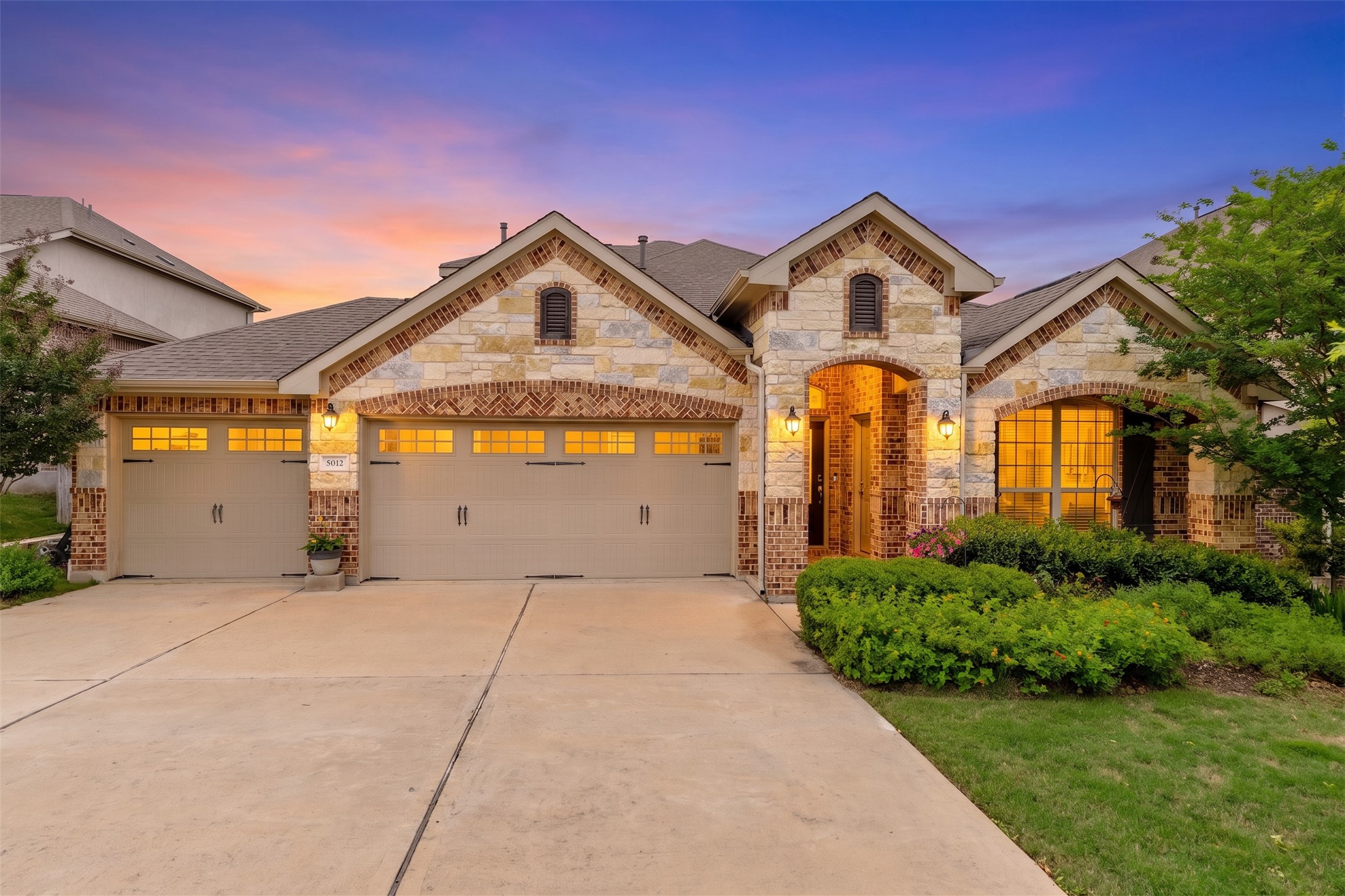 5012 Yucca Bloom Drive Georgetown, TX 78626 - Photo 1 of 35 Stone and brick facade featuring arched entryway
