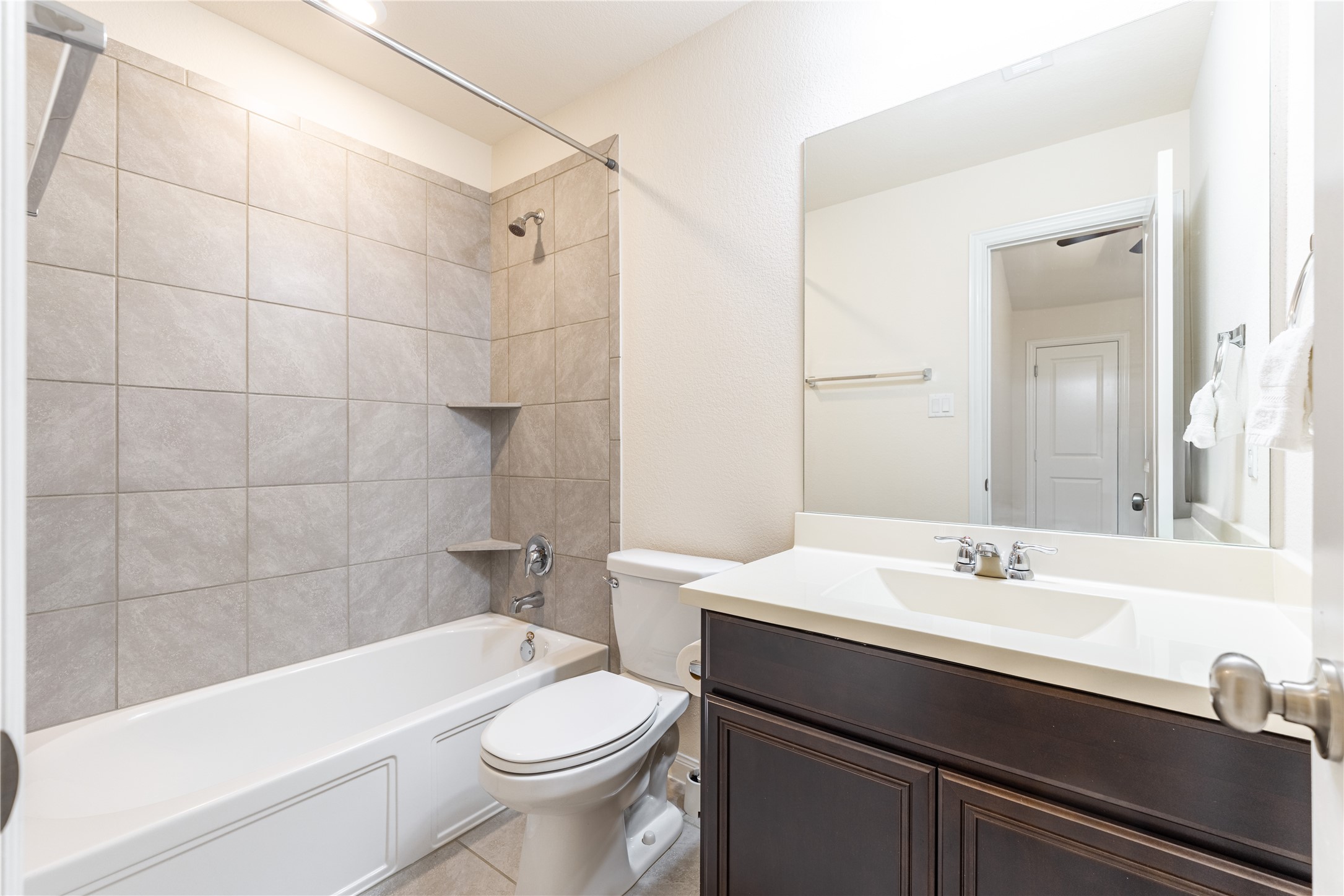 5012 Yucca Bloom Drive Georgetown, TX 78626 - Photo 24 of 35 Bathroom featuring a full vanity with dark wood-finish cabinetry and light countertop