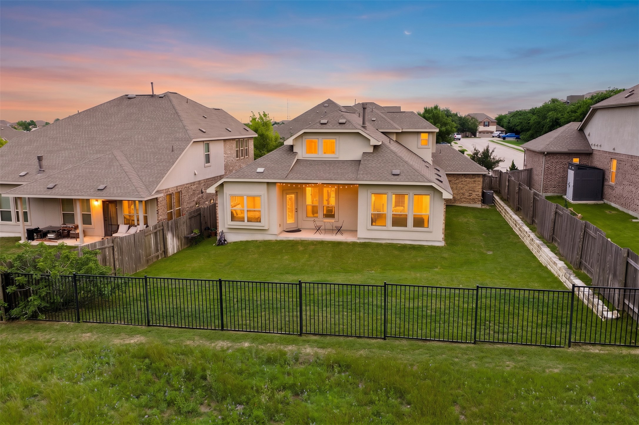 5012 Yucca Bloom Drive Georgetown, TX 78626 - Photo 27 of 35 Expansive backyard featuring a manicured lawn, full perimeter fencing, and a retaining wall