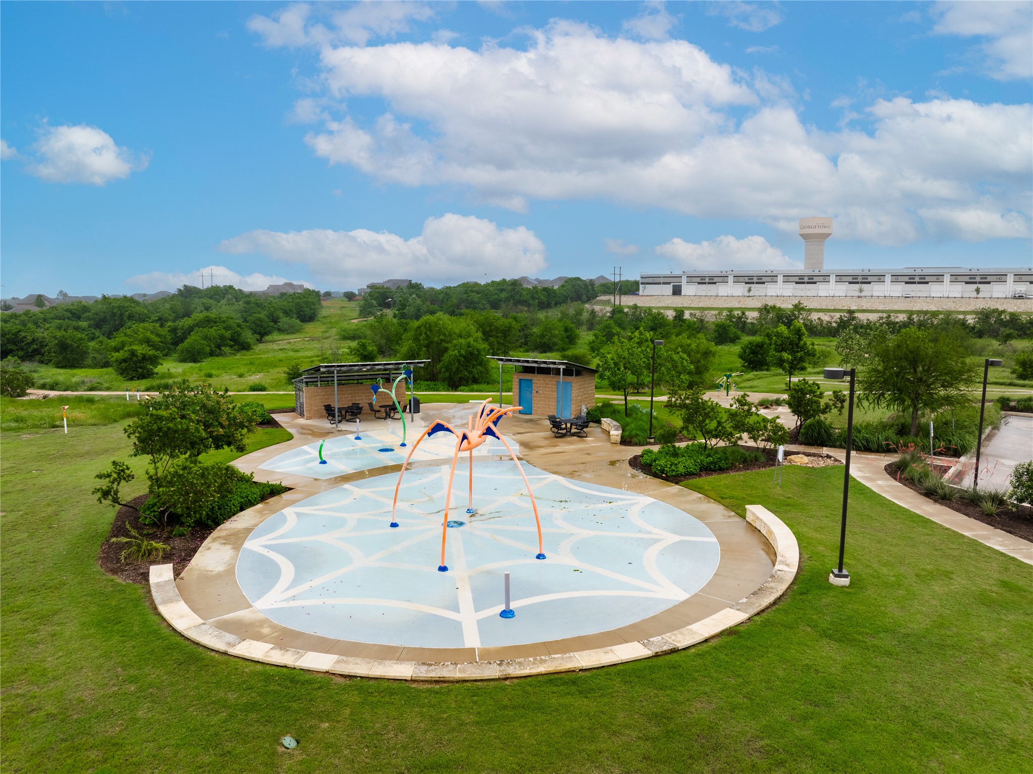 5012 Yucca Bloom Drive Georgetown, TX 78626 - Photo 31 of 35 Recreational splash pad featuring multiple water sprayers and a patterned surface