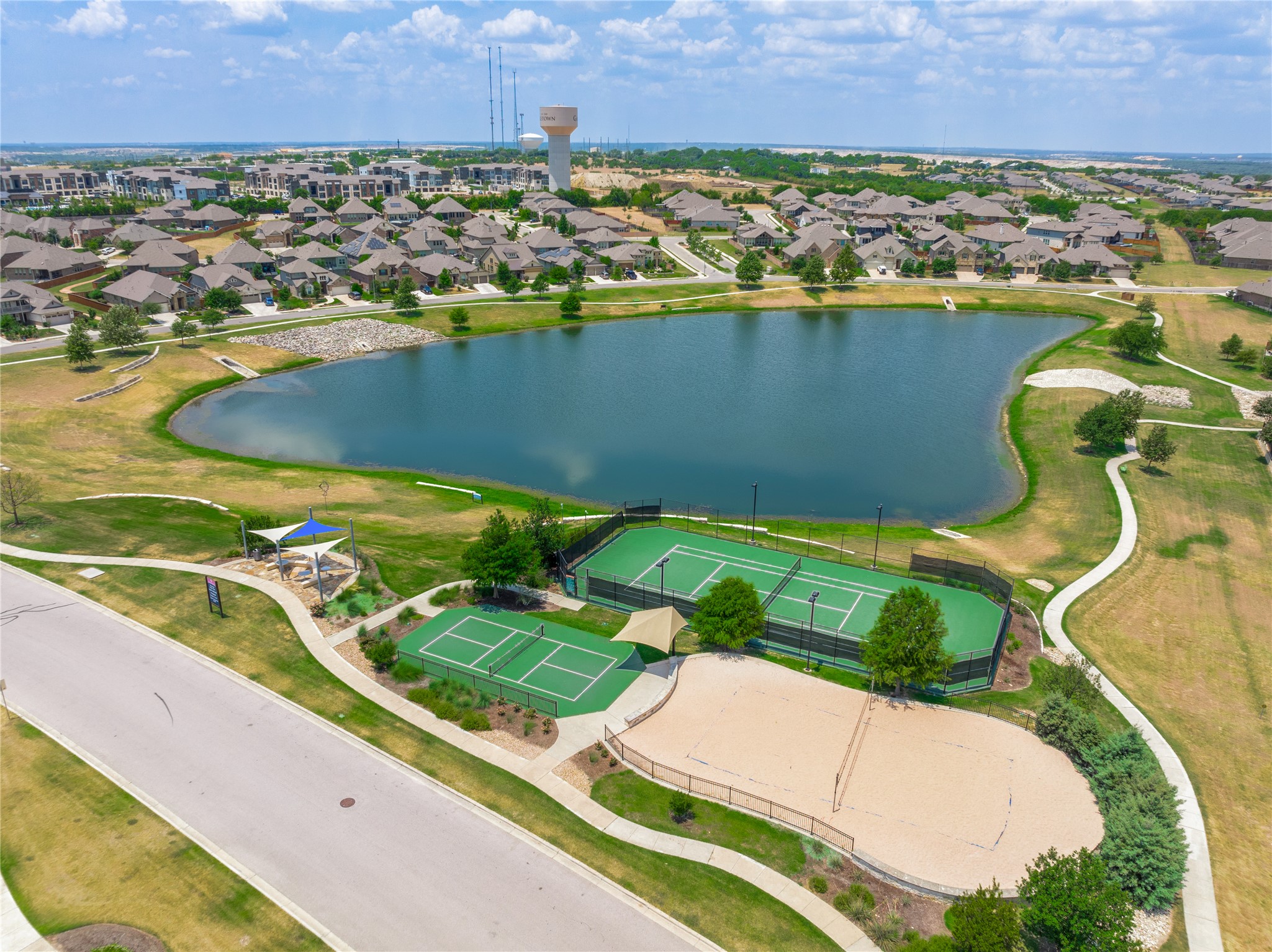 5012 Yucca Bloom Drive Georgetown, TX 78626 - Photo 34 of 35 Expansive community lake surrounded by residential properties