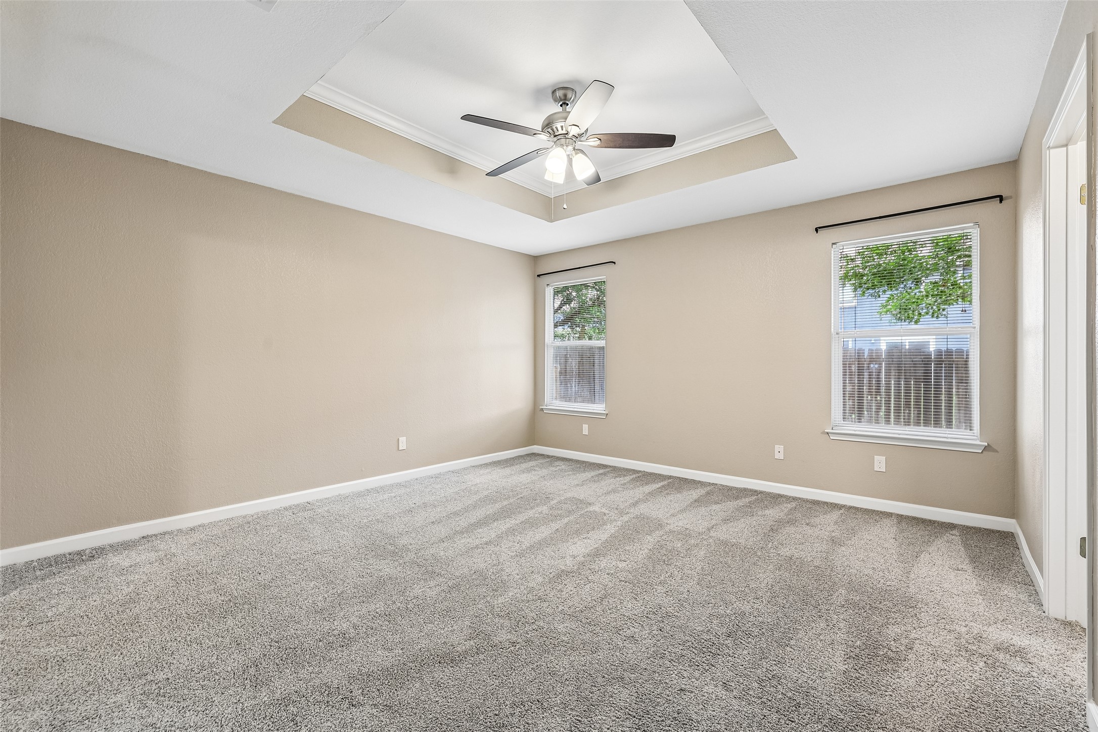 152 Grant Way Kyle, TX 78640 - Photo 22 of 39 an empty room with windows and fan