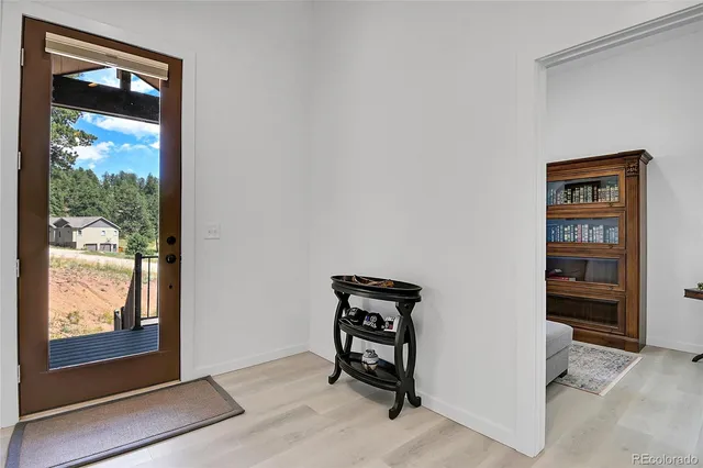a view of porch with wooden floor
