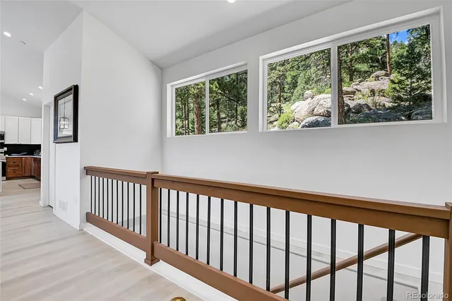 a bedroom with a bed and a lamp on table