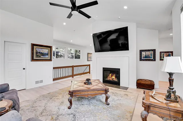 a living room with furniture and a rug