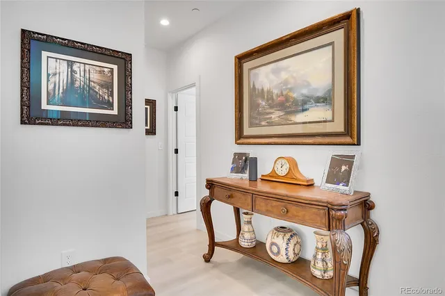 a kitchen with stainless steel appliances granite countertop a kitchen island a table and chairs