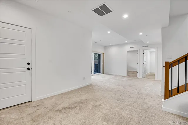 an empty room with windows and view