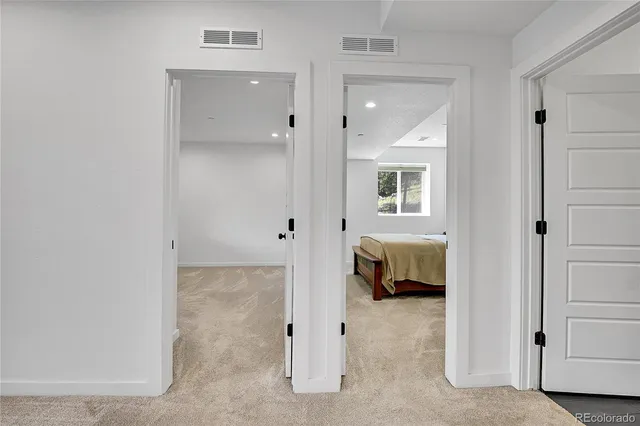 a view of an empty room with stairs