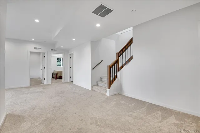 a view of a walk in closet and bathroom