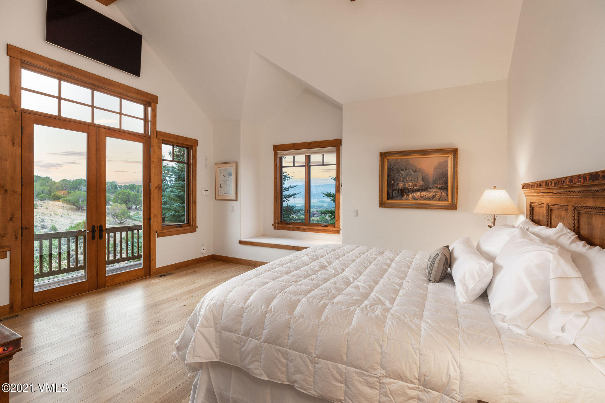 1168 Hernage Creek Road Eagle, CO 81631 - Photo 7 of 22 a bedroom with a large bed and a large window